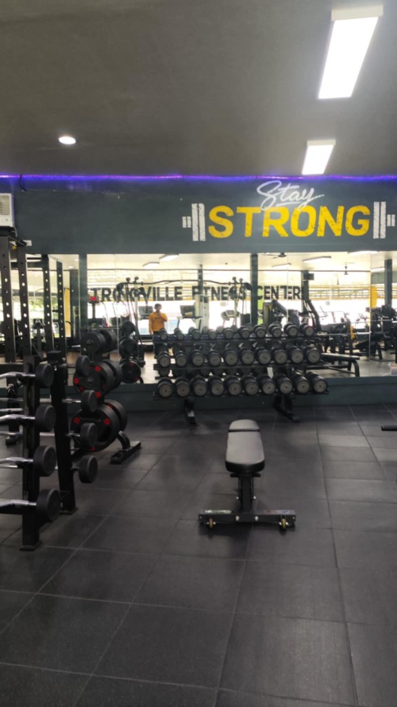 Troyville Fitness Center — weight room and Stay Strong wall